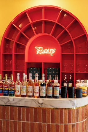 A bar area with a red arch and a neon sign that reads "Panny." - Paralia Khem Beach Phu Quoc Hotel (Phu Quoc)