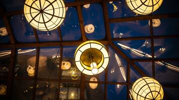 A ceiling with spherical light fixtures and a grid pattern.