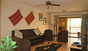 Suite Deluxe, 2 chambres | Coin séjour