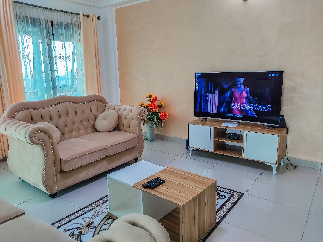 deluxe apartment, 3 bedrooms | living area | 32-inch flat-screen tv with satellite channels, tv