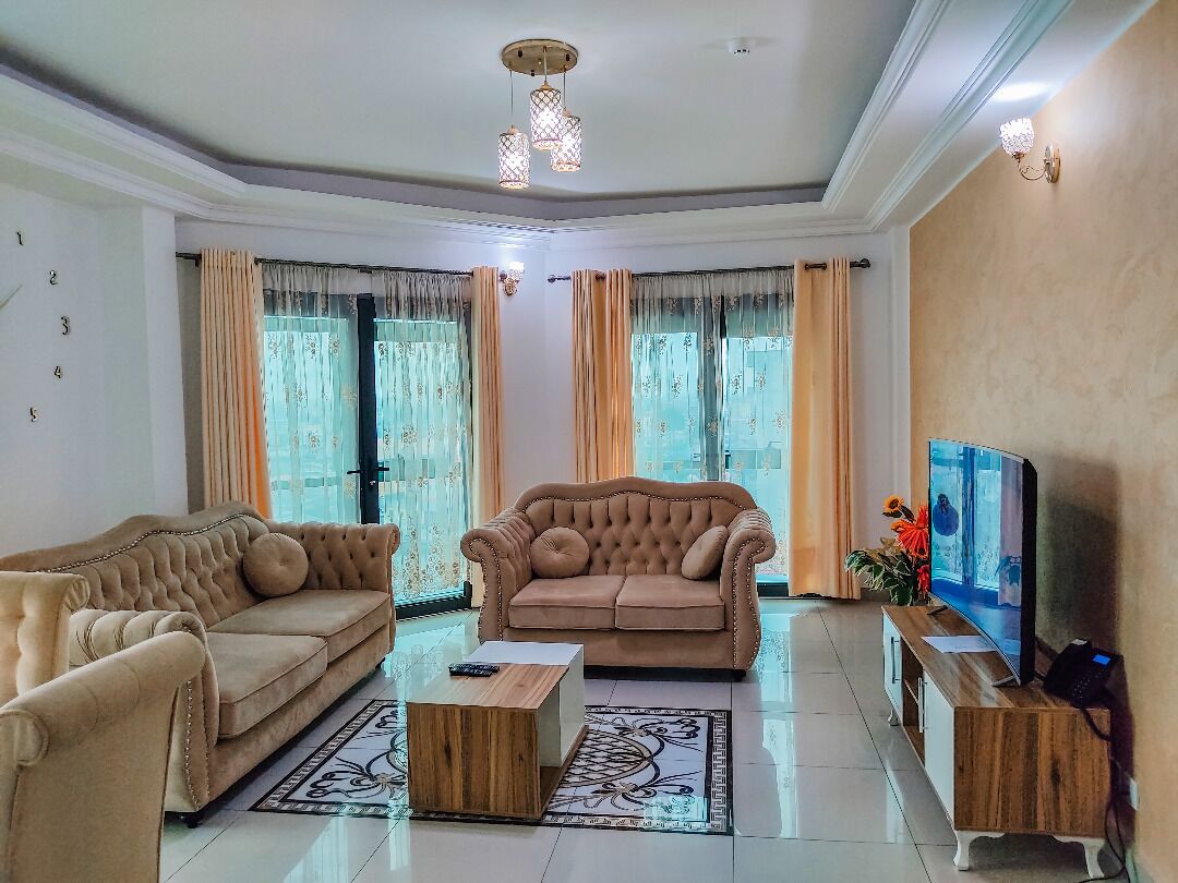 deluxe apartment, 3 bedrooms | living area | 32-inch flat-screen tv with satellite channels, tv