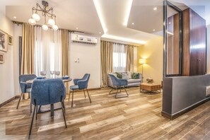 Deluxe Apartment, 3 Bedrooms | Living area | 32-inch flat-screen TV with satellite channels, TV - Appartement Meublé VIP Douala Bonapriso (Douala)