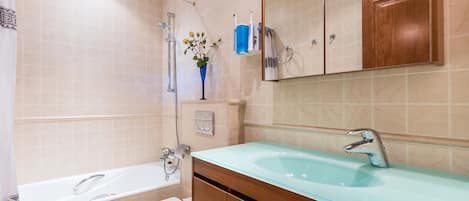 Bathtub, hair dryer, towels
