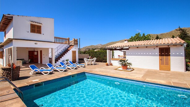 A swimming pool with lounge chairs, a staircase, and a small building with a tiled roof. - LA VINYA CAN OLIVER ( OLIVER ). Country house located between Pollensa and Pto. Pollensa (Puerto Pollensa)
