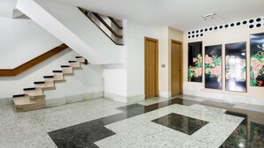 A modern interior with a staircase, a hallway, and artwork on the walls. - matarolux2 · 25km from Barcelona , Beach 200 meters (Mataro)