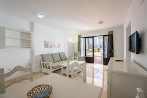 Apartment, 2 Bedrooms | Living room | Flat-screen TV - Apartamentos Flamingo (Tías)