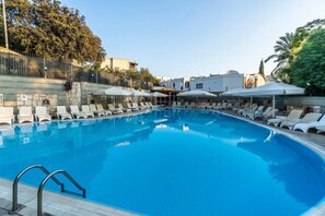 Seasonal outdoor pool, pool umbrellas, pool loungers