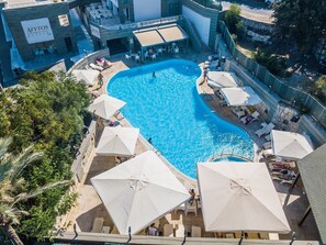 Seasonal outdoor pool, pool umbrellas, pool loungers