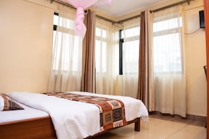 Desk, laptop workspace, free WiFi, bed sheets