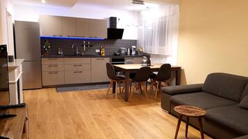 Family Apartment (incl. cleaning fee 40 EUR) | Living area | Flat-screen TV