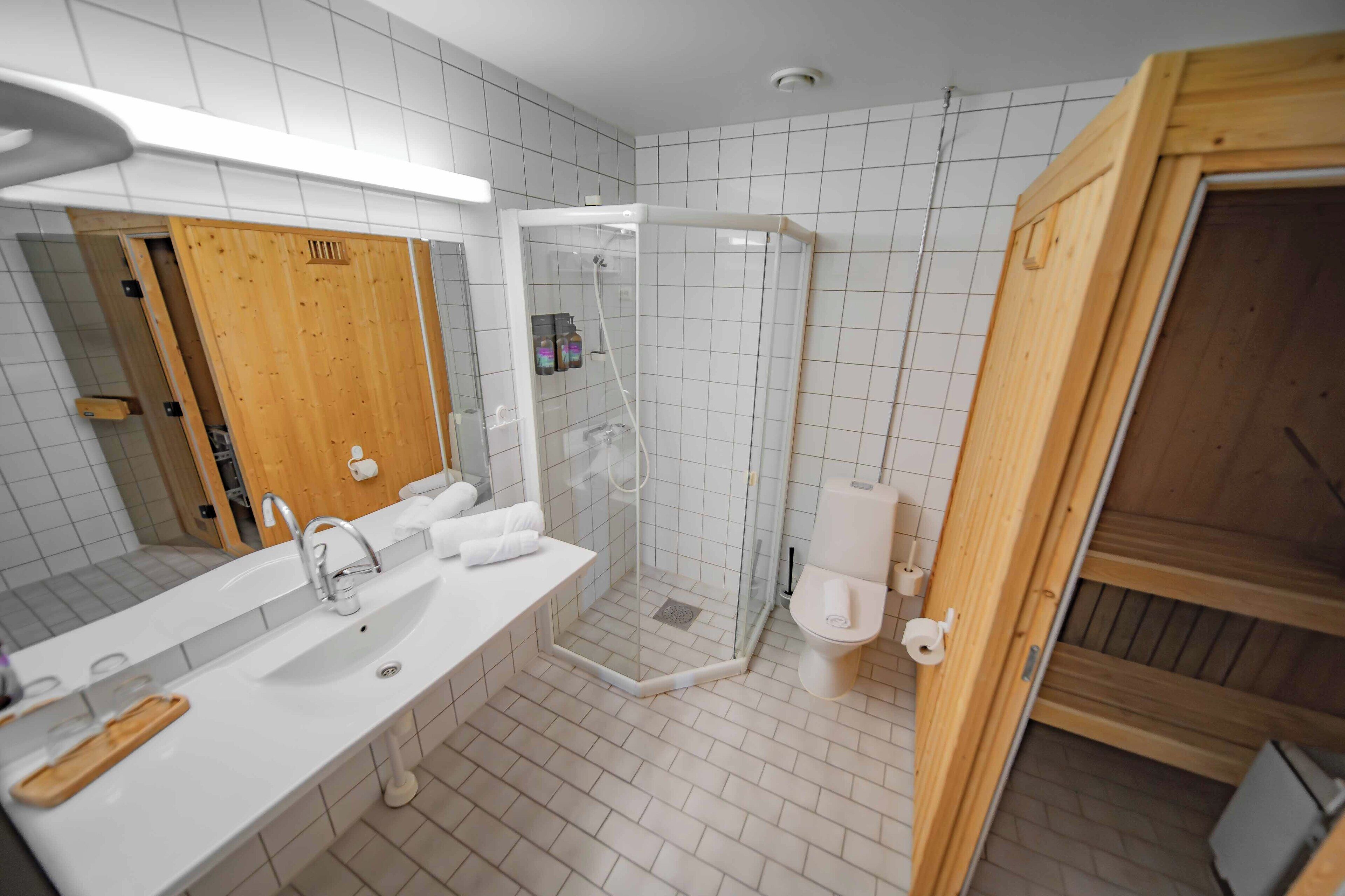 junior studio suite | bathroom | shower, free toiletries, hair dryer, heated floors