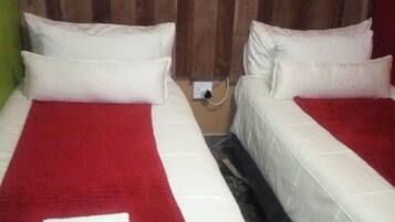 Economy Room, 1 Bedroom | 4 bedrooms, desk, free WiFi, bed sheets