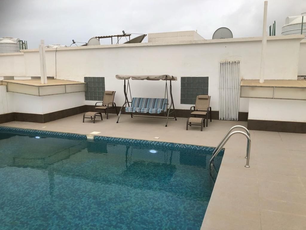 outdoor pool, pool loungers