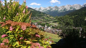 A mountainous landscape with a village nestled in the valley.