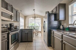 House, 4 Bedrooms | Private kitchen - Golf Course View From Pool! Southern Dunes Golf! 4 Bedroom Home by RedAwning (Haines City)