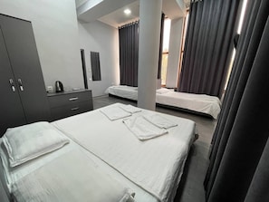 Family Suite, Multiple Beds, Non Smoking, Courtyard View | Iron/ironing board, free WiFi, bed sheets
