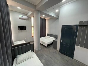 Family Suite, Multiple Beds, Non Smoking, Courtyard View | Iron/ironing board, free WiFi, bed sheets