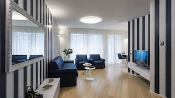 Deluxe Apartment | Living room | Flat-screen TV