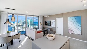 A modern hotel room with a balcony, a dining area, and a living space. - Relaxing Getaway with Intracoastal Views (Hollywood)