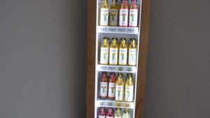 A refrigerated display case with various bottles of alcohol, including brands like Honest and Vio. - D´r Rechenmacher Pension und Landgasthof (Michelfeld)
