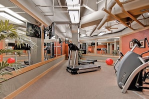 Stay fit on the go with a fully equipped gym featuring a treadmill, stationary bike, and rowing machine.