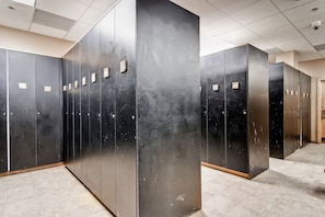 Elevators line the floor, each with a control panel above.