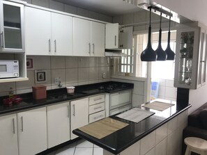 Microwave, coffee/tea maker, cookware/dishes/utensils