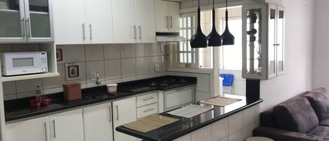 Microwave, coffee/tea maker, cookware/dishes/utensils