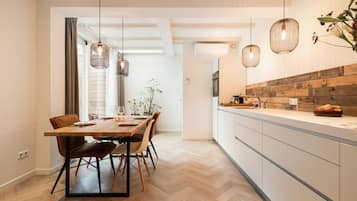 Apartment A | Private kitchen | Full-size fridge, microwave, oven, dishwasher