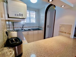 Fridge, microwave, coffee/tea maker, toaster