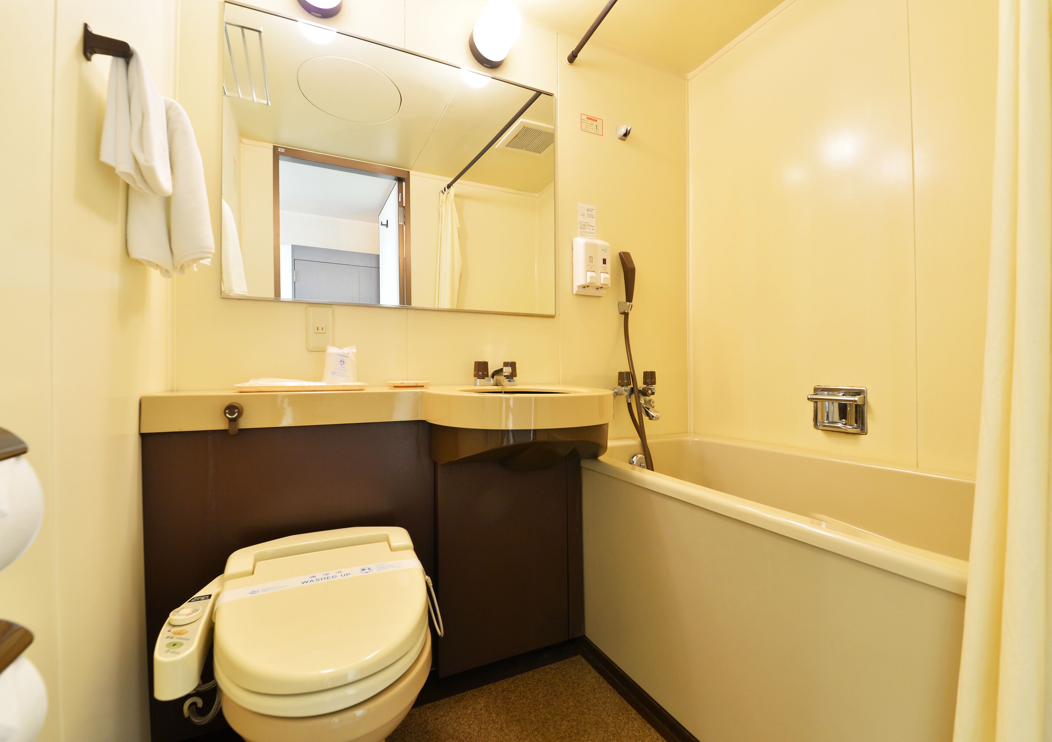 combined shower/bathtub, free toiletries, hair dryer, slippers