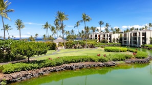 Breathtaking views of the fish pond, landscaping & the ocean, all from the lanai