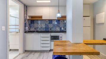 Fridge, microwave, coffee/tea maker, toaster