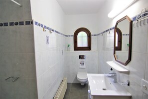 A compact bathroom with a white sink, a mirror, and a toilet. - VILLAVALLEY-Wifi Free (Calpe)