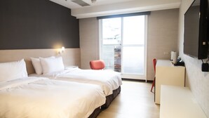 A modern hotel room with two beds, a red chair, a desk with a coffee machine, and a large window. - Hatago+  The Alley (Taipei)