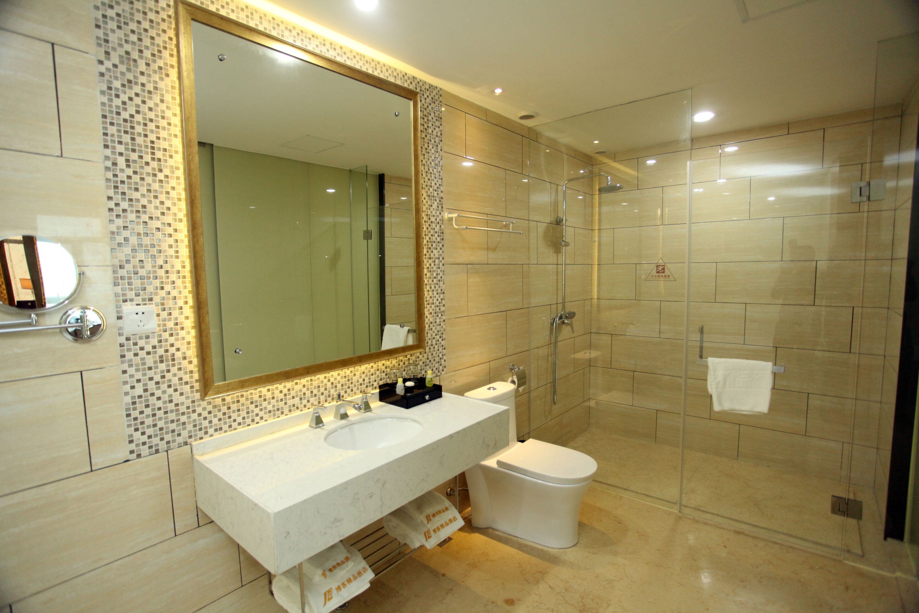 Signature Suite | Bathroom | Shower, free toiletries, hair dryer, slippers