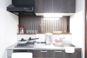 Apartment | Private kitchenette | Fridge, microwave, electric kettle, cookware/dishes/utensils - Ko's Apartment, Tatsumi West Station (Osaka)