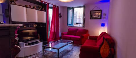 Apartment, 1 Bedroom | Living area | 60-cm flat-screen TV with digital channels, LCD TV, DVD player
