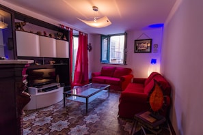 Apartment, 1 Bedroom | Living area | 60-cm flat-screen TV with digital channels, LCD TV, DVD player