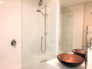 Bathtub, hair dryer, towels, soap