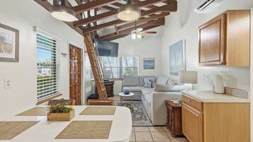 Suite, 2 Bedrooms | Living area | 32-inch flat-screen TV with cable channels, TV