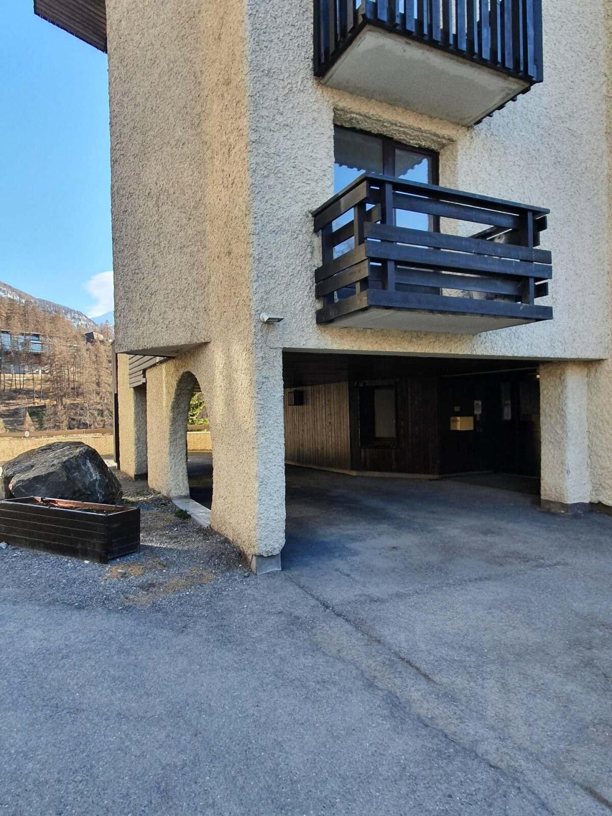 A two-story building with a balcony on the upper floor.