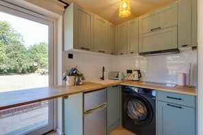 Fridge, microwave, toaster, cookware/dishes/utensils