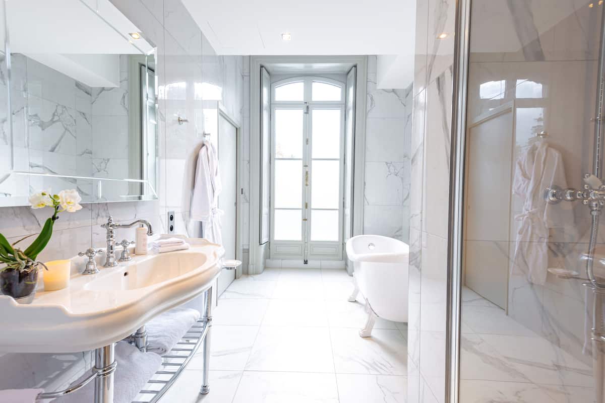 superior room | bathroom | rainfall showerhead, free toiletries, hair dryer, bathrobes