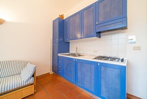 Apartment, 1 Bedroom (Bilocale 2 Baia Blu) | Private kitchen | Fridge, microwave, stovetop, coffee/tea maker