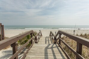 On the beach, sun-loungers