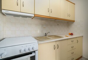 Fridge, coffee/tea maker, highchair, cookware/dishes/utensils