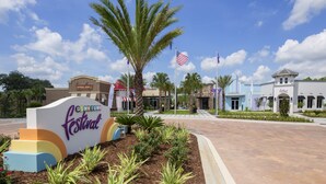 A sign for the Downtown Festival with a palm tree and American flag.