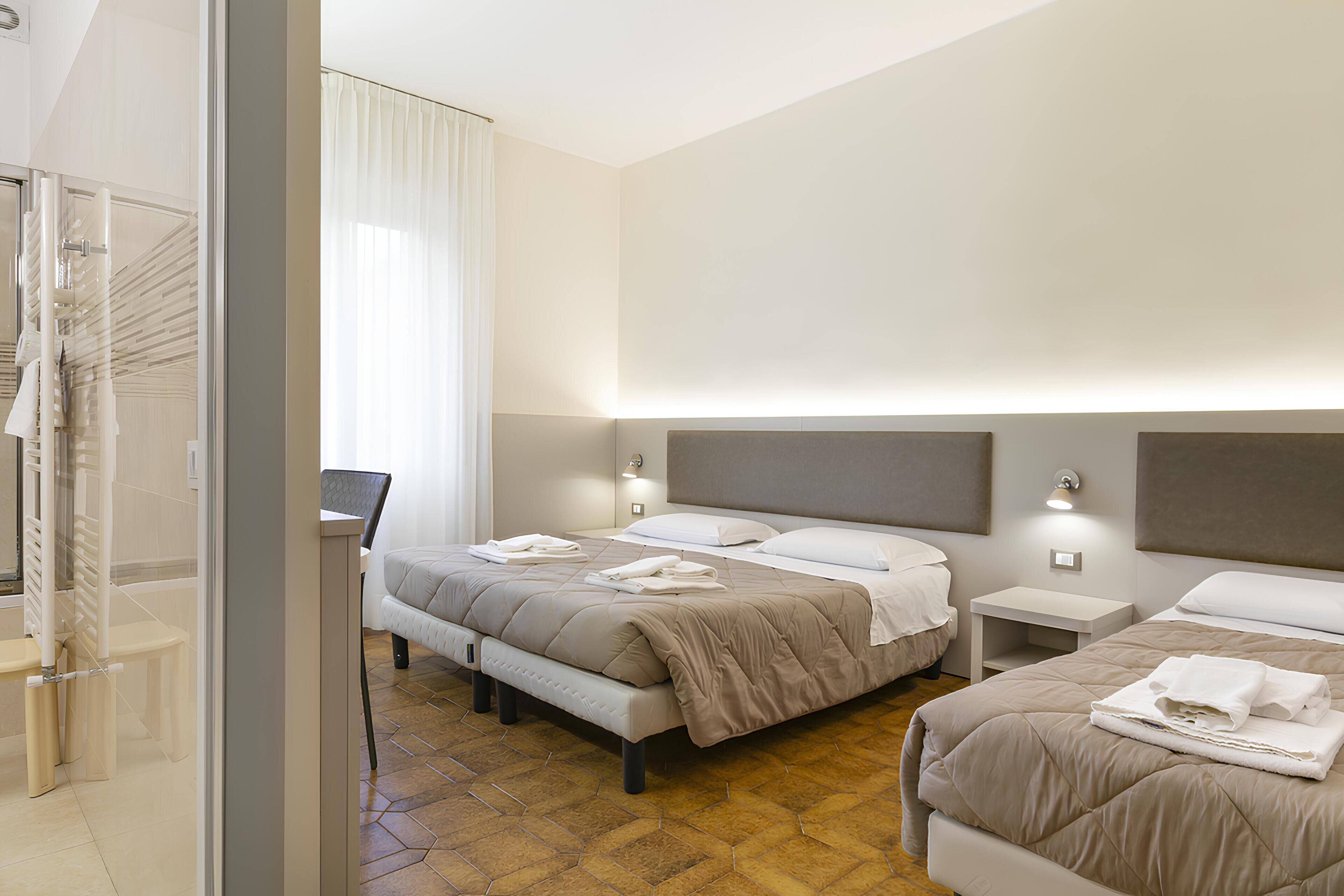 Superior Triple Room | Down comforters, desk, laptop workspace, iron/ironing board