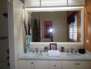 Bathtub, towels, soap, toilet paper